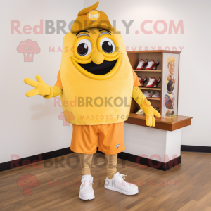 Gold Enchiladas mascot costume character dressed with a Polo Tee and Shoe clips