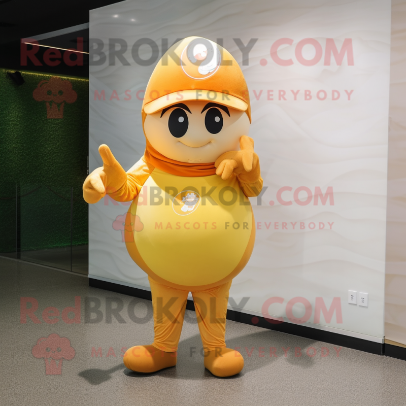 Gold Apricot mascot costume character dressed with a V-Neck Tee and Caps