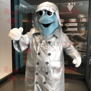 Silver Aglet mascot costume character dressed with a Raincoat and Cufflinks