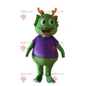 Green dinosaur mascot dressed in very warm purple -