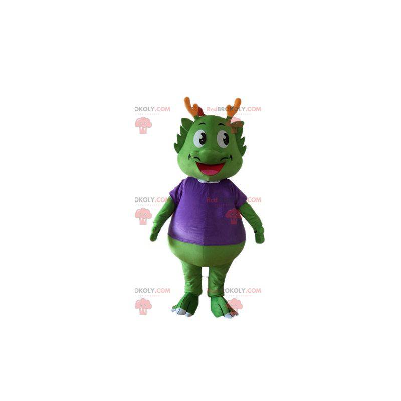 Mascota dinosaurio verde vestida de morado muy cálido -