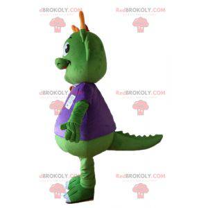 Mascotte dinosauro verde vestita di viola molto caldo -