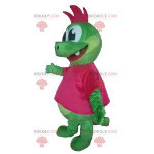 Mascota dragón dinosaurio verde con una cresta rosa -