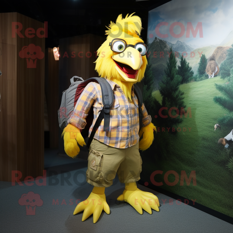 Yellow Rooster mascot costume character dressed with a Flannel Shirt and Backpacks Yellow Rooster mascot costume character dressed with a Flannel Shirt and Backpacks