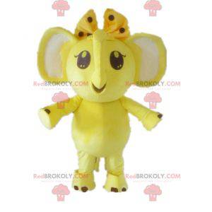 Mascotte d'éléphant jaune et blanc avec un nœud sur la tête -