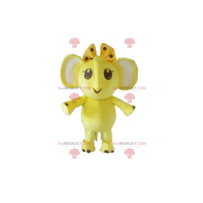 Mascotte elefante giallo e bianco con un fiocco sulla testa -