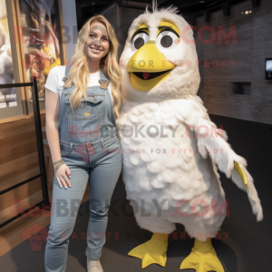 White Canary mascot costume character dressed with a Dungarees and Watches