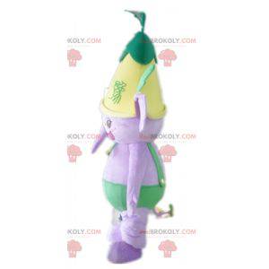 Purple elephant mascot in green outfit with a flower -