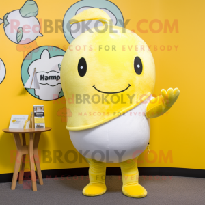 Lemon Yellow Narwhal mascot costume character dressed with a Graphic Tee and Tie pins