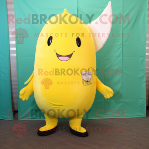 Lemon Yellow Narwhal mascot costume character dressed with a Graphic Tee and Tie pins