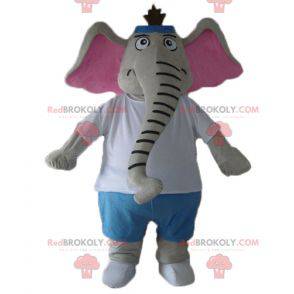 Szaro-różowa maskotka słoń w niebiesko-białym stroju -