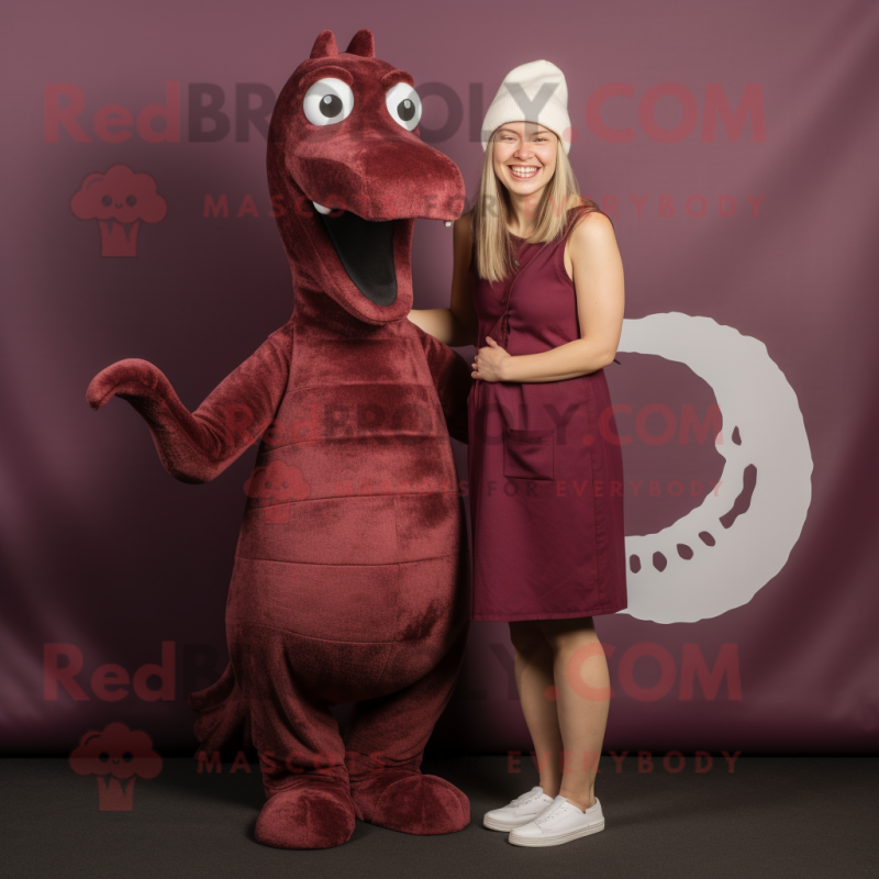 Maroon Loch Ness Monster mascot costume character dressed with a Mini Dress and Beanies Maroon Loch Ness Monster mascot costume character dressed with a Mini Dress and Beanies