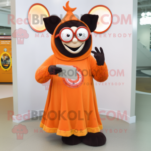 Orange Vampire mascot costume character dressed with a Circle Skirt and Reading glasses