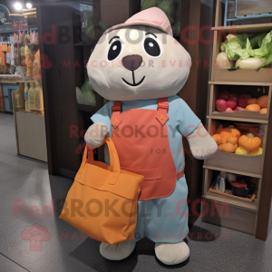 Peach Seal mascot costume character dressed with a Dungarees and Tote bags