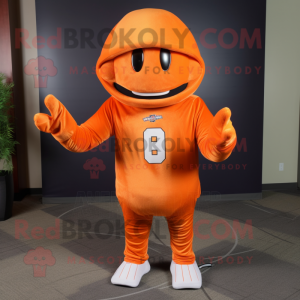 Orange American Football Helmet mascot costume character dressed with a Long Sleeve Tee and Shawl pins
