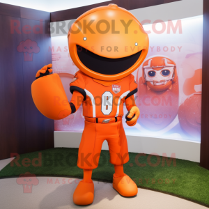 Orange American Football Helmet mascot costume character dressed with a Long Sleeve Tee and Shawl pins