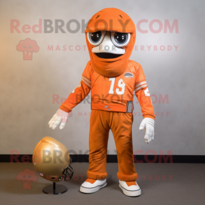 Orange American Football Helmet mascot costume character dressed with a Long Sleeve Tee and Shawl pins