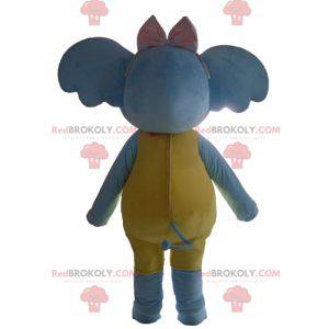 Mascotte elefante blu giallo e rosa attraente e colorato -