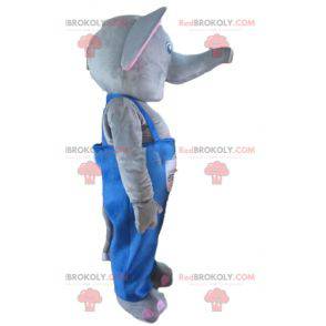 Grijze en roze olifant mascotte met blauwe overall -