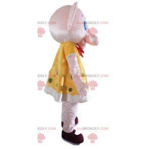 Pink elephant mascot in yellow dress with green polka dots -