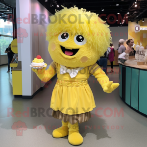 Yellow Cupcake mascot costume character dressed with a Henley Shirt and Hair clips