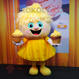 Yellow Cupcake mascot costume character dressed with a Henley Shirt and Hair clips