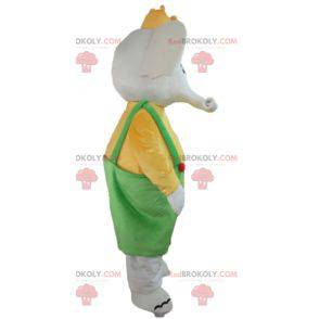 Elefante mascote em traje amarelo e verde com uma coroa -