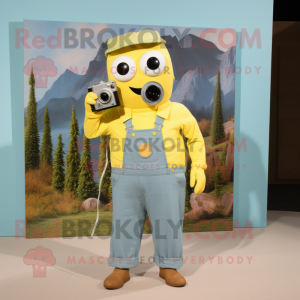 Yellow Camera mascot costume character dressed with a Chambray Shirt and Earrings