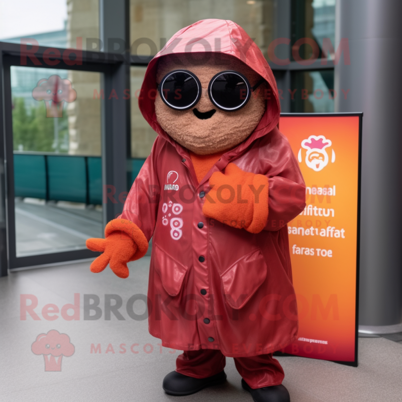 Rust Raspberry mascot costume character dressed with a Raincoat and Sunglasses Rust Raspberry mascot costume character dressed with a Raincoat and Sunglasses