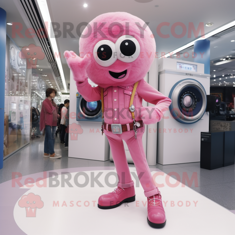 Pink Camera mascot costume character dressed with a Flare Jeans and Watches