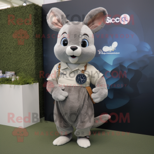 Tan Chinchilla mascot costume character dressed with a Polo Shirt and Smartwatches