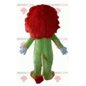 Mascotte de lion jaune et rouge avec une combinaison verte -