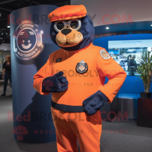 Orange Navy Seal mascot costume character dressed with a Polo Shirt and Lapel pins