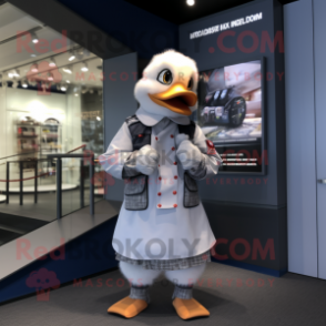 Silver Muscovy Duck mascot costume character dressed with a Trousers and Smartwatches