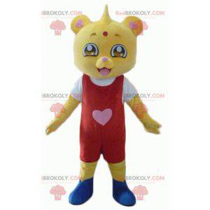 Mascotte de nounours jaune en tenue rouge et blanche -