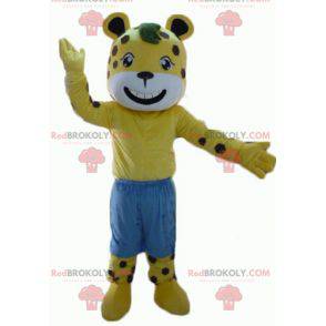 Yellow and white tiger mascot with brown polka dots with shorts