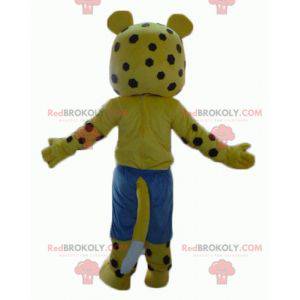 Yellow and white tiger mascot with brown polka dots with shorts