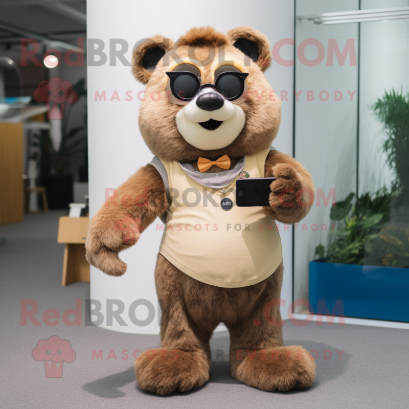 Beige Spectacled Bear mascot costume character dressed with a Jeggings and Watches