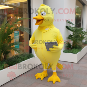 Lemon Yellow Pigeon mascot costume character dressed with a Capri Pants and Wallets