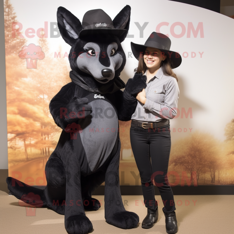 Black Dingo mascot costume character dressed with a Mom Jeans and Hats