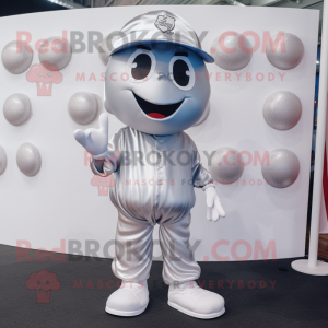 Silver Candy mascot costume character dressed with a Polo Shirt and Hats
