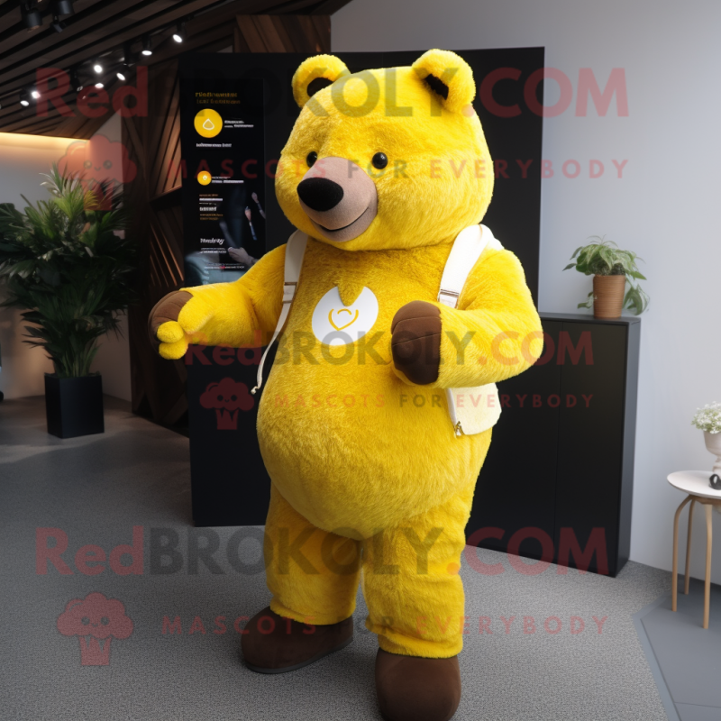 Yellow Bear mascot costume character dressed with a Cardigan and Smartwatches