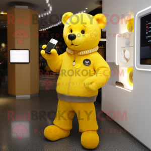 Yellow Bear mascot costume character dressed with a Cardigan and Smartwatches