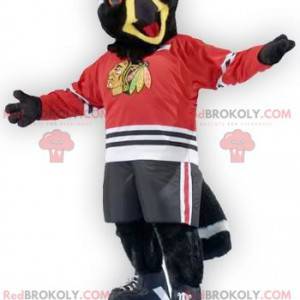 Black and white bird eagle mascot in sportswear - Redbrokoly.com
