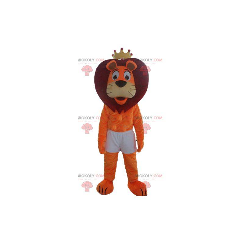 Mascote leão vermelho e laranja em shorts com uma coroa -