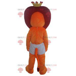 Mascote leão vermelho e laranja em shorts com uma coroa -