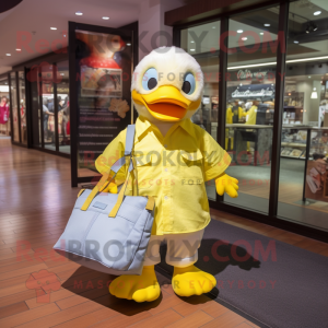 Lemon Yellow Duck mascot costume character dressed with a Dress Shirt and Tote bags
