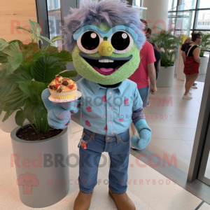 Olive Cupcake mascot costume character dressed with a Chambray Shirt and Sunglasses