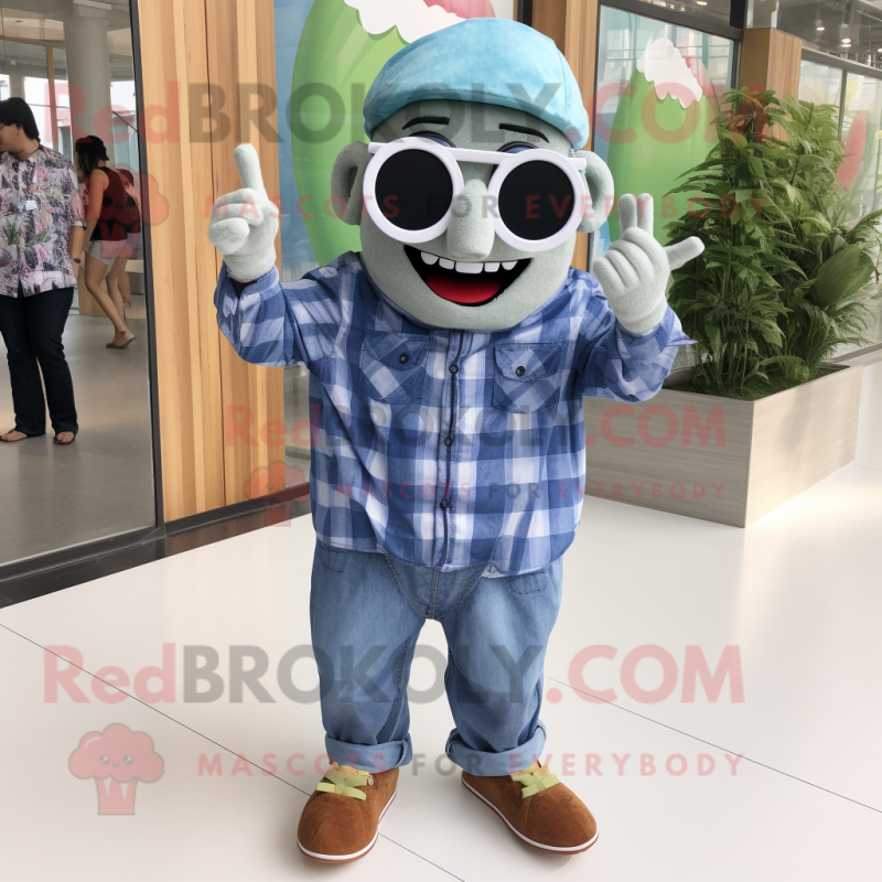 Olive Cupcake mascot costume character dressed with a Chambray Shirt and Sunglasses Olive Cupcake mascot costume character dressed with a Chambray Shirt and Sunglasses