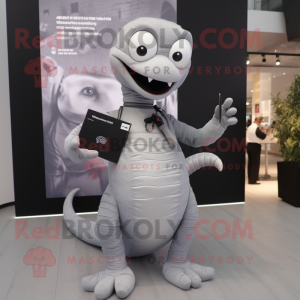 Gray Hydra mascot costume character dressed with a Bodysuit and Clutch bags